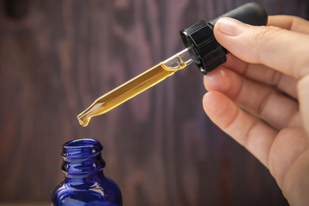 small bottle and pipette filled with cd oil