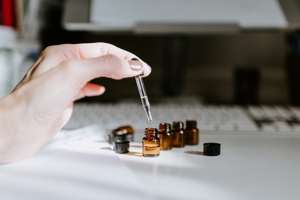 small bottles with oil and a pipette